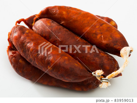 Sausages chorizo on white surface 83959013