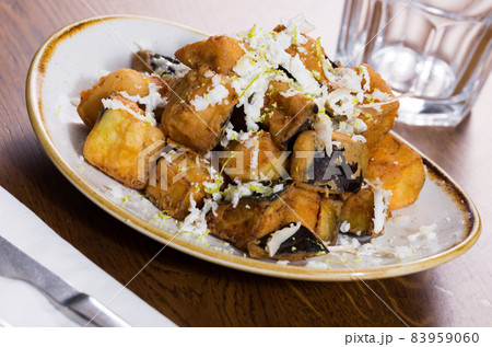 Plate with steamed eggplants with honey and cheese Plate with steamed eggplants with honey and cheese 83959060