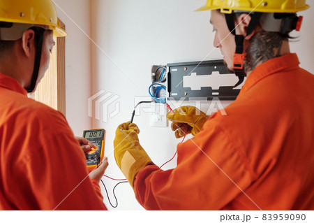 Electricians Testing Electrical Wires 83959090