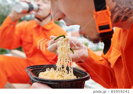 Construction Worker Eating Ramen Soup 83959241