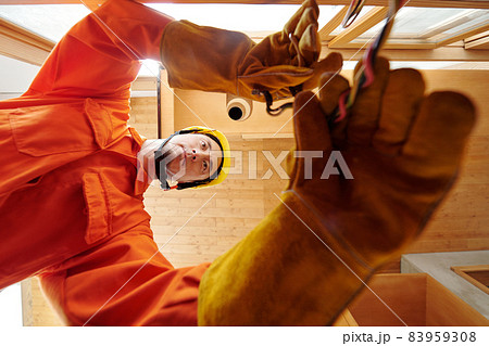 Electrician Conducting Electricity in New House 83959308