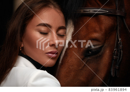 portrait beautiful woman long hair next horse 83961894