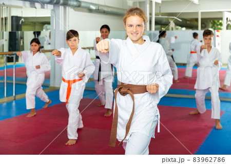 Karate kids doing kata in gym 83962786