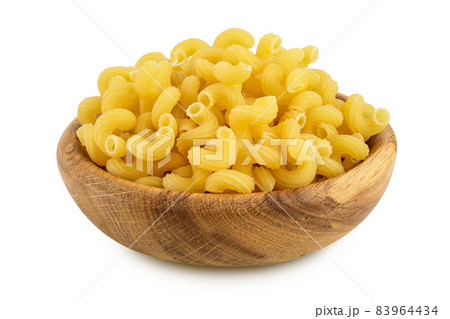 raw pasta cavatappi in wooden bowl isolated on white background with clipping path and full depth of field. 83964434