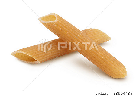 Wolegrain penne pasta from durum wheat isolated on white background with clipping path and full depth of field. 83964435