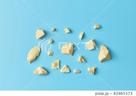 Pile of raw cocoa butter chunks 83965373
