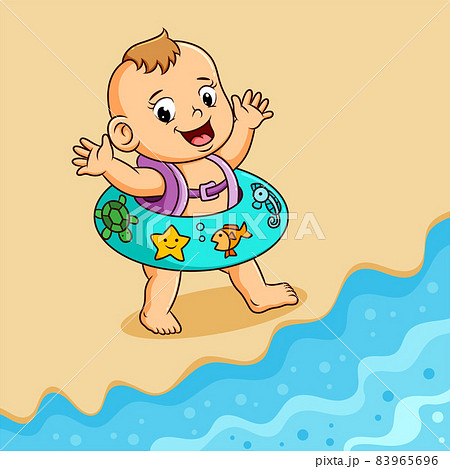 The baby is walking in the beach with the cute tire  83965696
