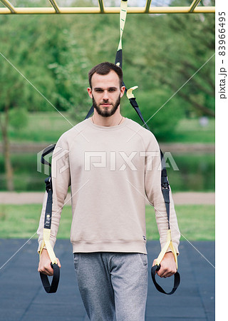 Caucasian sportsman on crossbar during street workout. Healthy lifestyle and street sport concept 83966495