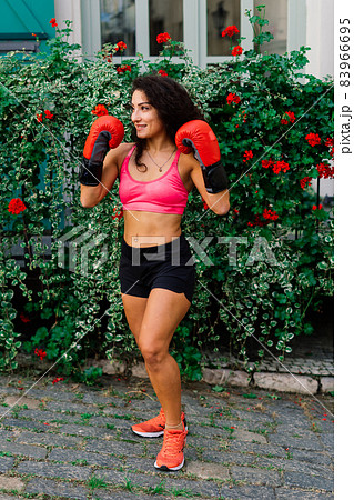 Woman power, self defence concept. Portrait of attractive serious fit boxer, ready for fight 83966695