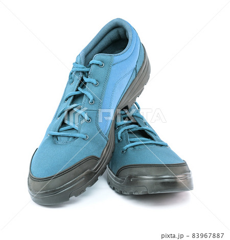 a pair of blue cheap durable fabric travel shoes isolated on white background 83967887