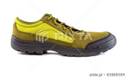 right cheap yellow hiking or hunting shoe isolated on white background right cheap yellow hiking or hunting shoe isolated on white background 83968564