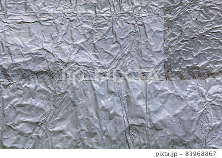 crumpled thick aluminium foil wall insulation surface texture and background 83968867