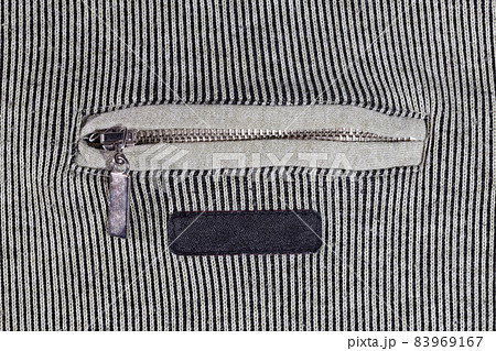 abstract vertical striped texture of flat fabric surface with zip locking chest pocket, and black blank label 83969167