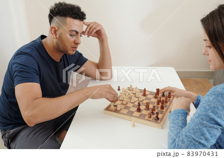 Man Thinking on Next Move in Game 83970431
