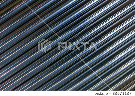 abstract industrial background of shiny cnc turned rods with flat lay diagonal geometric composition 83971137