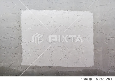 Gray plaster wall background with white rectangle in center, Mockup. Gray plaster wall background with white rectangle in center, Mockup. 83971204