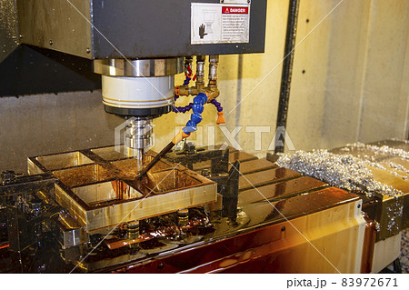 The CNC milling machine cutting the  vacuum mold parts with oil coolant method. 83972671