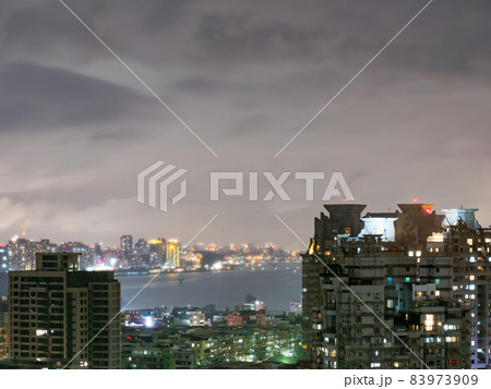 Night view of the riverbank city at night in Taipei, Taiwan. 83973909