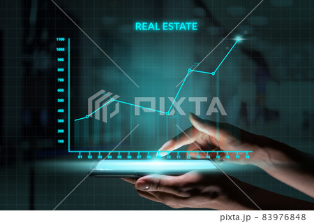Business investment concept. Person holding smartphone with Abstract graph real estate growth 83976848