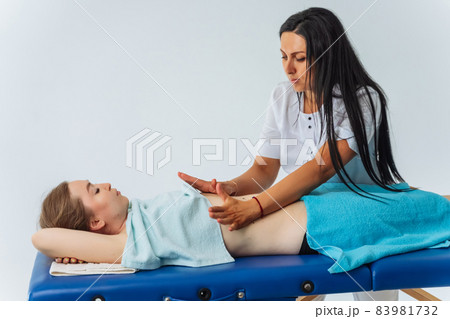 Young woman having massage in spa salon. Wellness, healing and relaxation concept. Young woman having massage in spa salon. Wellness, healing and relaxation concept. 83981732