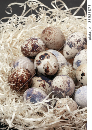 Food background top view of quail eggs close-up containing vitamin A, B, PP, B12, amino acids, beta-carotene, calcium, magnesium, iron, phosphorus, protein, choline, riboflavin, folic acid, selenium Food background top view of quail eggs close-up containing vitamin A, B, PP, B12, amino acids, beta-carotene, calcium, magnesium, iron, phosphorus, protein, choline, riboflavin, folic acid, selenium 83983873