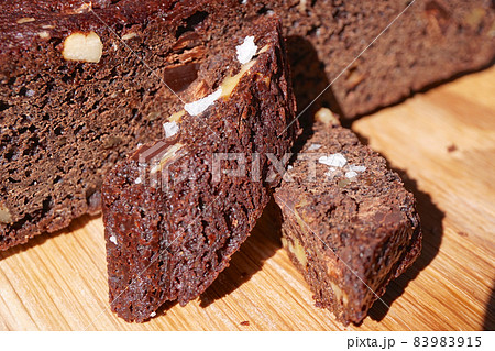 Chocolate cake brownie with nuts on wood plate 83983915