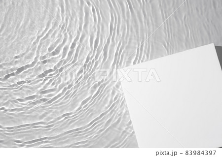 Empty white square podium on transparent clear water background Empty white square podium on transparent clear water background 83984397
