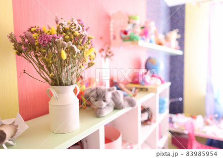 Dried flowers for decoration are in vase in children room closeup 83985954