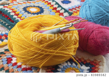 Various crochet hooks, handmade crocheting granny square 83989382