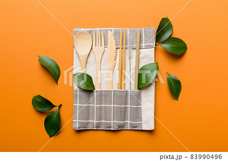 Eco friendly reusable recyclable white eco bag with kitchenware on Colored background. Concept zero waste 83990496