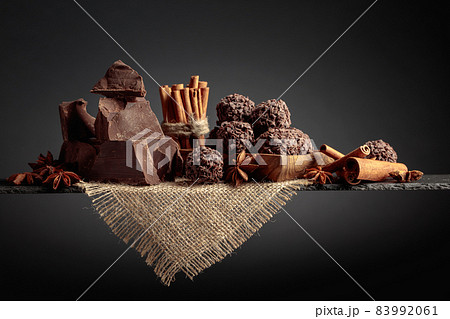 Chocolate candies with broken pieces of chocolate.. 83992061