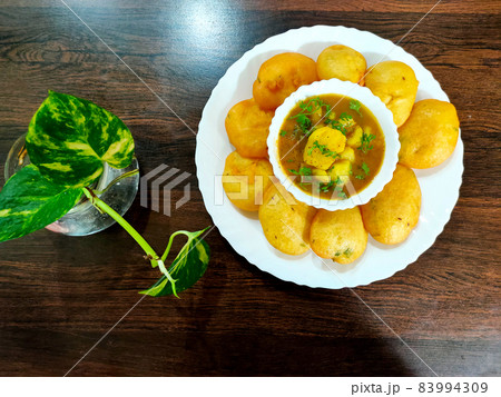 Jharkhand's famous snack Dhuska with potato curry 83994309