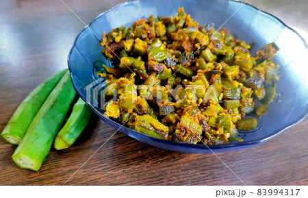 Indian masala fried bhindi or Okra or ladyfinger curry or sabji, selective focus Indian masala fried bhindi or Okra or ladyfinger curry or sabji, selective focus 83994317