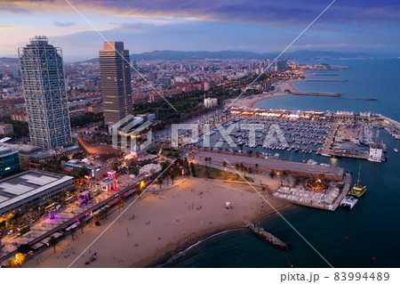 Evening aerial view of coastal area of Barcelona in summer, Spain 83994489