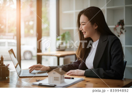 Business people gather in a corporate location to discuss research using paperwork. Concept of a group of businesses cooperating. Business people gather in a corporate location to discuss research using paperwork. Concept of a group of businesses cooperating. 83994892