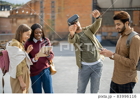 Mixed races students at university campus outdoors 83996116