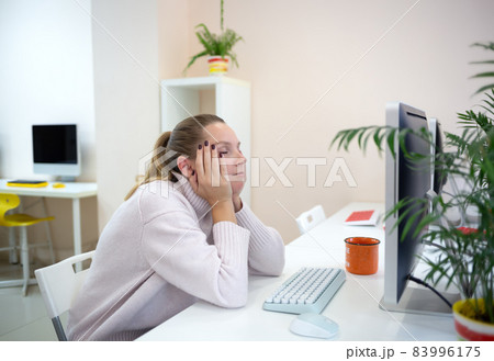 young woman is sad at the workplace. office work concep young woman is sad at the workplace. office work concep 83996175