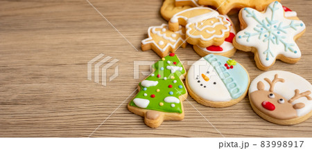 Merry Christmas with homemade cookies on wood table background. Xmas, party, holiday and happy New Year concept 83998917