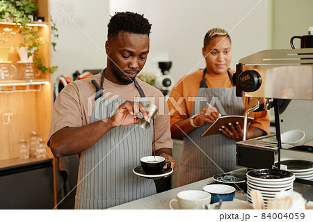 Young People Working In Cafe 84004059