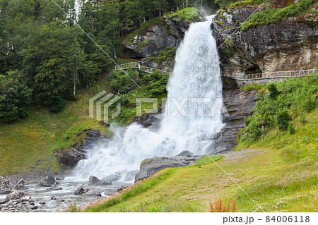 Steinsdalfossen Waterfall. Norway. Summer. Waterfall among the forest 84006118