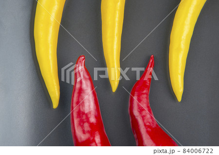 yellow, red and green hot chili on a plate. Pepper. Vegetable vitamin food. yellow, red and green hot chili on a plate. Pepper. Vegetable vitamin food. 84006722