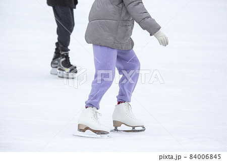 ice skating woman legs on ice rink. hobbies and winter sports ice skating woman legs on ice rink. hobbies and winter sports 84006845