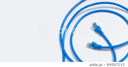 LAN network connection ethernet blue cables on white background. 84007231