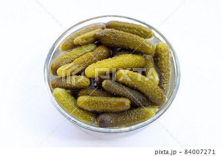 Pickled gherkins or cucumbers on white background. Pickled gherkins or cucumbers on white background. 84007271