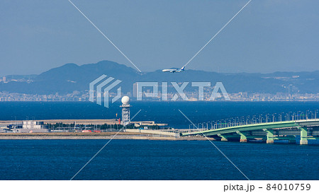 ANA plane landing at the Kansai International Airport in Osaka, Japan 84010759