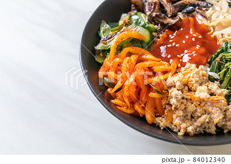 Korean spicy salad with rice - traditionally Korean food, Bibimbap Korean spicy salad with rice - traditionally Korean food, Bibimbap 84012340