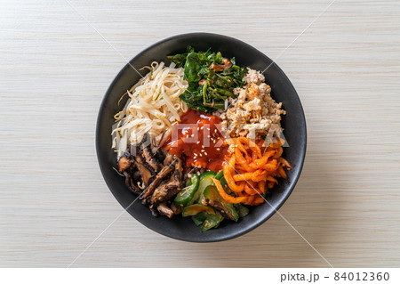Korean spicy salad with rice - traditionally Korean food, Bibimbap Korean spicy salad with rice - traditionally Korean food, Bibimbap 84012360