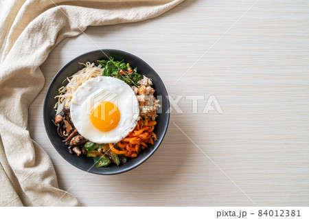 Korean spicy salad with rice - traditionally Korean food, Bibimbap Korean spicy salad with rice - traditionally Korean food, Bibimbap 84012381