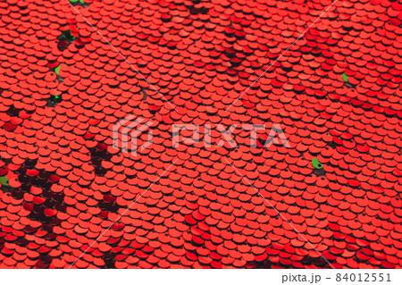 Abstract luxury red background with sequins sequins. Template for modern creative holiday design, new year, party, valentines day 84012551
