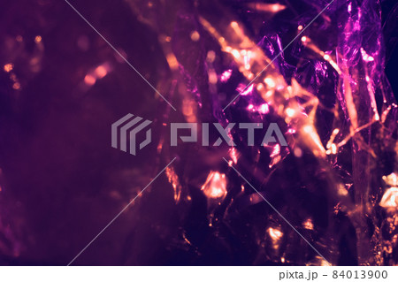 Abstract purple colorful background shiny crumpled hologram with sparkles. Trendy neon glowing textured background. Template for creative holiday design Abstract purple colorful background shiny crumpled hologram with sparkles. Trendy neon glowing textured background. Template for creative holiday design 84013900